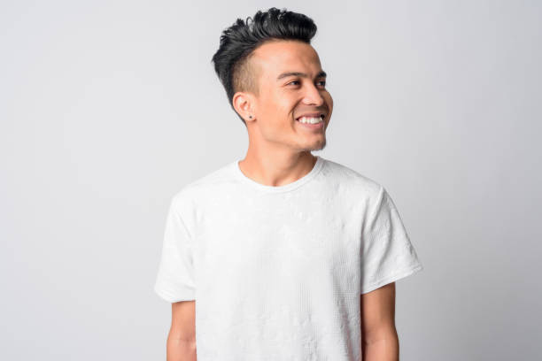 istock Face of happy young Asian man thinking 1209165246