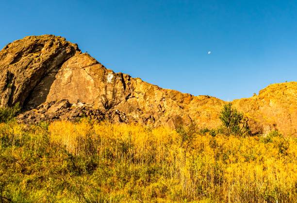 istock Golden Butte and Moon 1209166594
