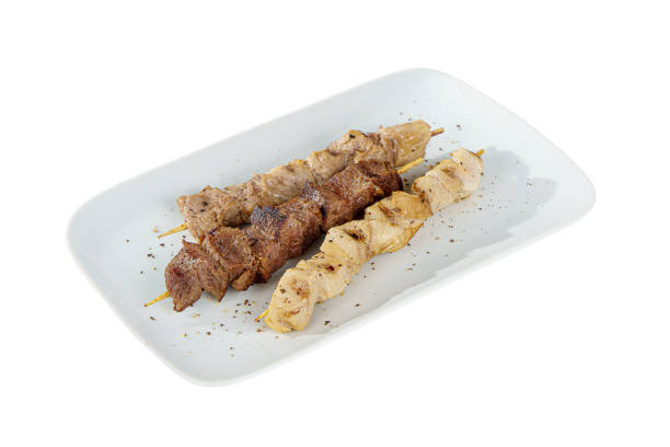 istock Assorted shish kebab, souvlaki plate isolated on white 1209173433