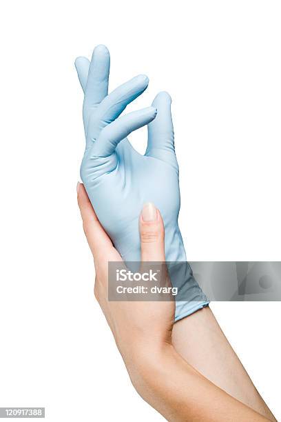 Blue Gloved Hand Stock Photo - Download Image Now - Assistance, Blue, Care