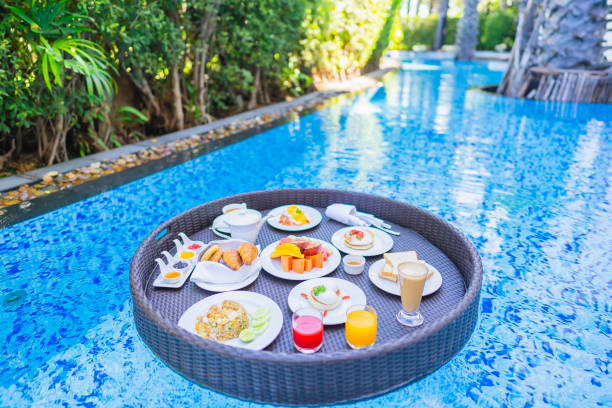 istock Floating breakfast set in tray with fried egg omelette sausage ham bread fruit milk juice coffee 1209176629