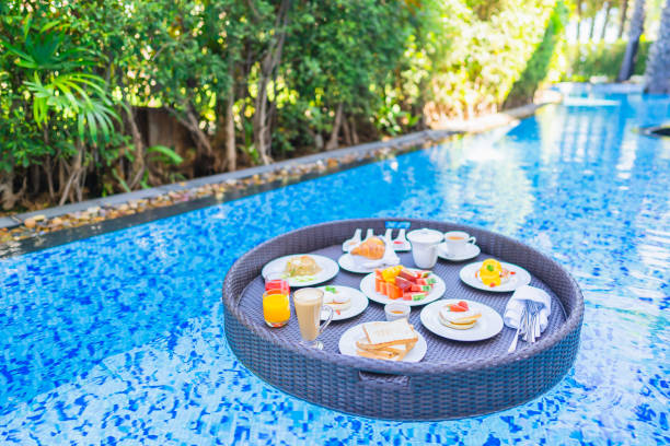 istock Floating breakfast set in tray with fried egg omelette sausage ham bread fruit milk juice coffee 1209176742
