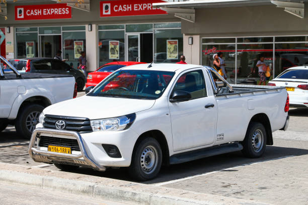 Toyota Hilux Rundu, Namibia - February 8, 2020: Pickup truck Toyota Hilux in the town street. toyota hilux stock pictures, royalty-free photos & images