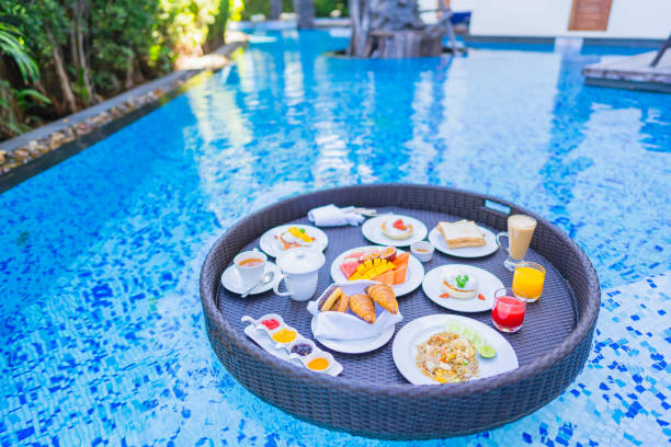 istock Floating breakfast set in tray with fried egg omelette sausage ham bread fruit milk juice coffee 1209176809