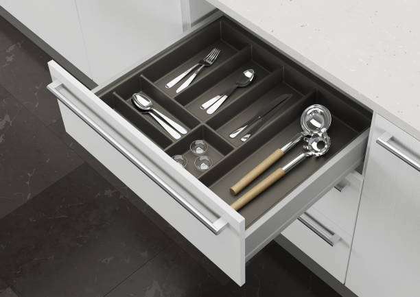 istock Open kitchen drawer with cooking utensils. Storage and organization of the kitchen. 3d rendering. 1209179534