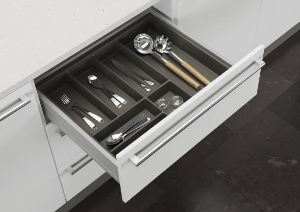 istock Open kitchen drawer with cooking utensils. Storage and organization of the kitchen. 3d rendering. 1209179545
