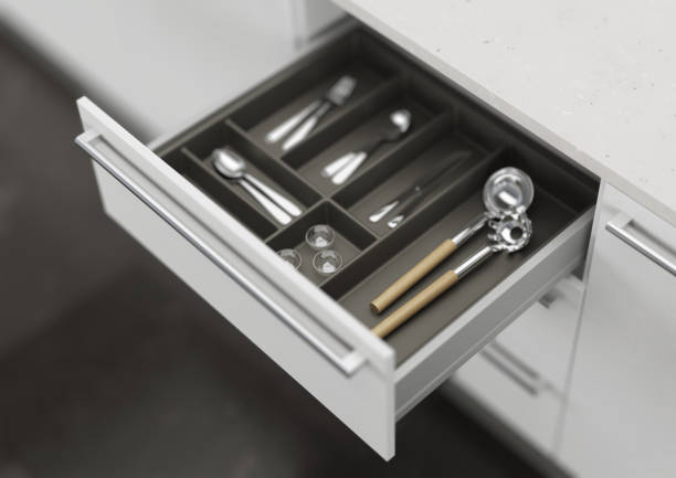 istock Open kitchen drawer with cooking utensils. Storage and organization of the kitchen. 3d rendering. 1209179546