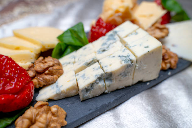 istock Cheese platter with walnut, salad and strawberry 1209180935
