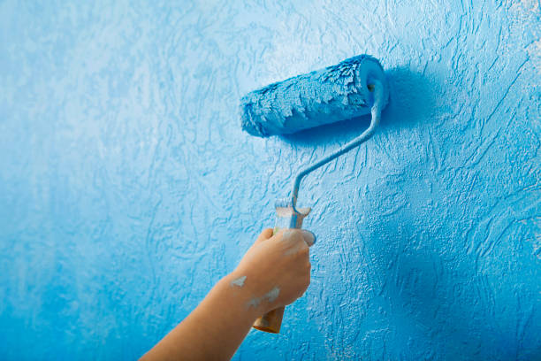istock Painting walls with own hands with roller 1209185640