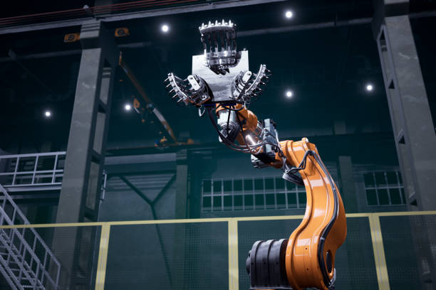 istock Orange robot in a factory 1209185662
