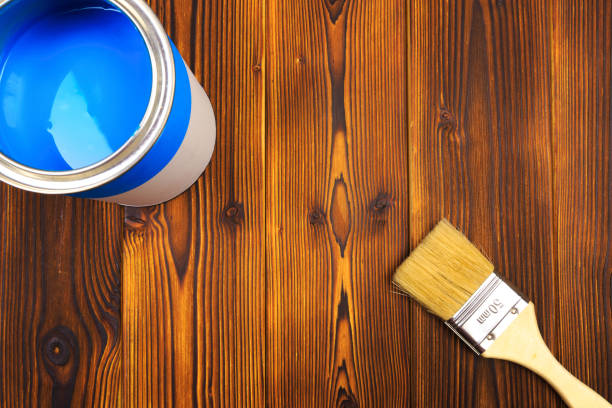 istock House renovation, paint can on the old wooden background with copy space 1209189201