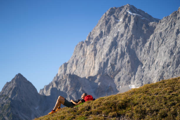 istock hiking woman relaxing in nature 1209189299
