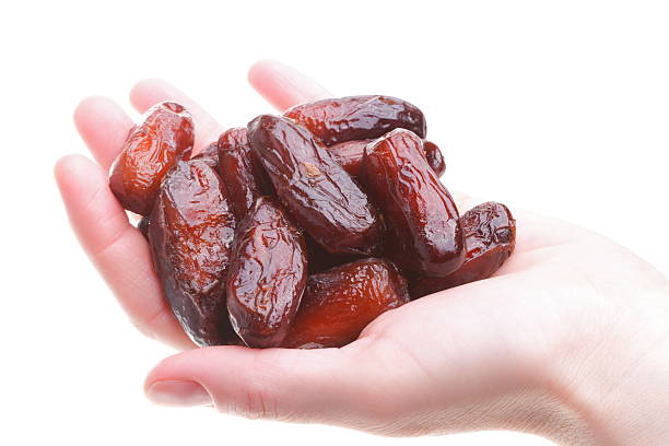 istock Dried date fruits in palm isolated 120919000