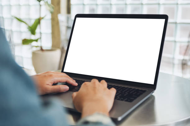 istock a woman using and typing on laptop computer with blank white desktop screen 1209194122