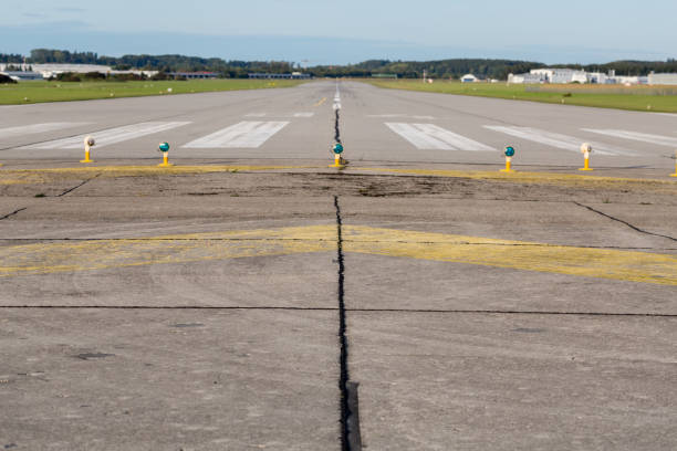 istock Straight view on empty runway / landing strip. 1209194418