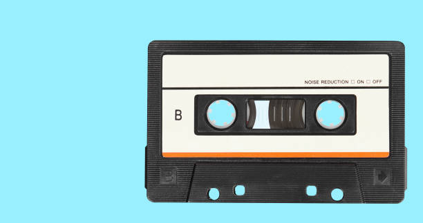 istock Retro audio tape cassette on a blue background. Top view 1209194450