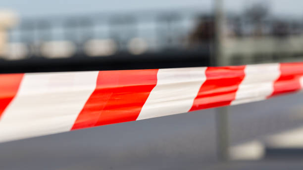 istock Close up of red & white striped plastic tape. 1209194554
