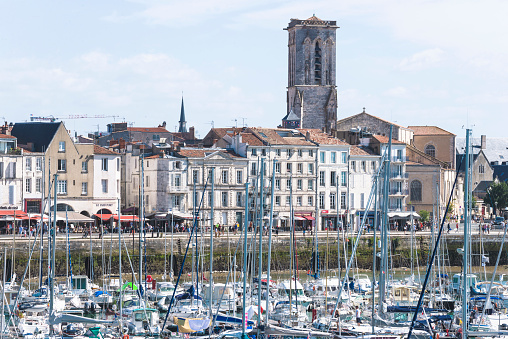 La Rochelle, France/07/28/2018: Old port of La Rochelle in summer day. Many yachts in front of buildings