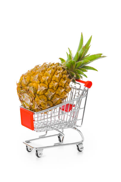 istock Ripe pineapple in shopping cart 1209196440