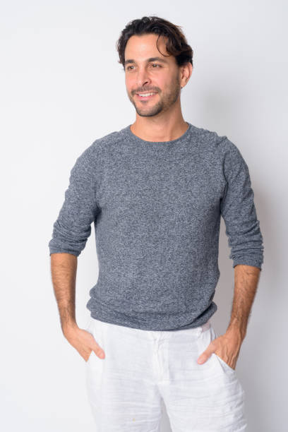 istock Portrait of happy handsome Hispanic man thinking 1209196997