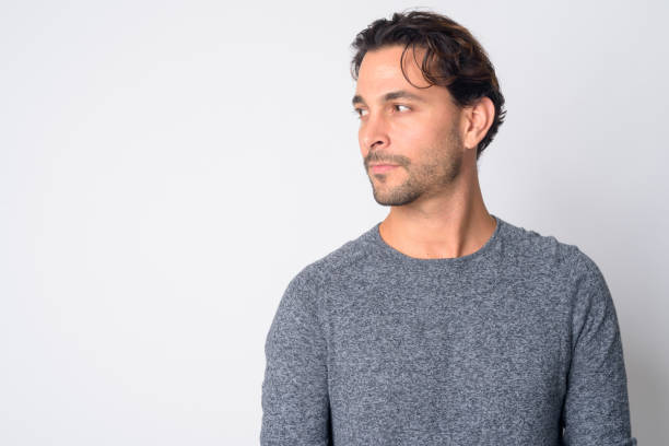 istock Face of handsome Hispanic man thinking and looking away 1209197019