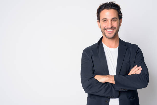 portrait of happy handsome hispanic businessman smiling with arms crossed - 30s imagens e fotografias de stock