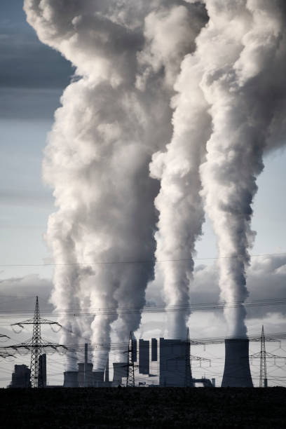 istock Modern coal burning power plant with pollution 1209198910