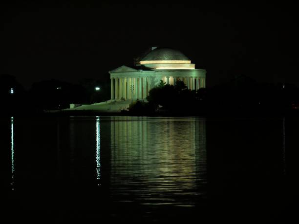 istock Thomas Jefferson Memorial building reflected in the Potomac River at night, Washington D.C. 1209201979