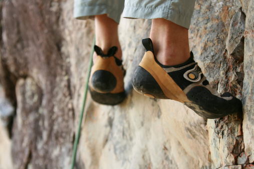 Rockclimbing shoes using sticky rubber to stand on almost nothing.