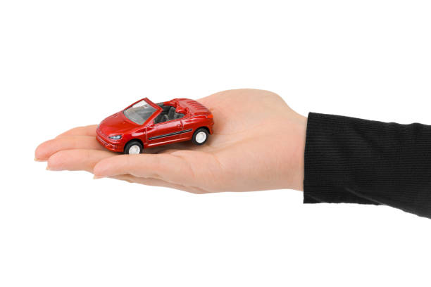 istock Hand and toy car 1209202272