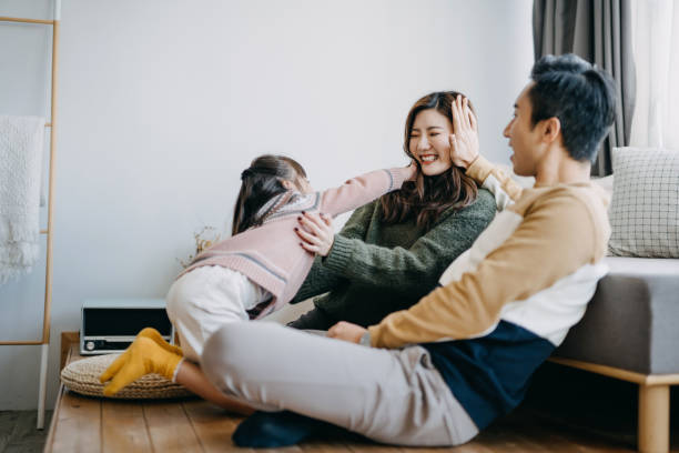 istock Young family spending quality time at home and having fun together 1209205020