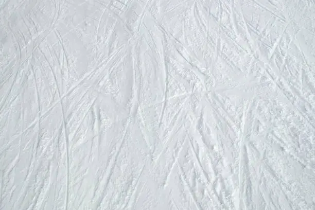 Photo of Snow and ski tracks background