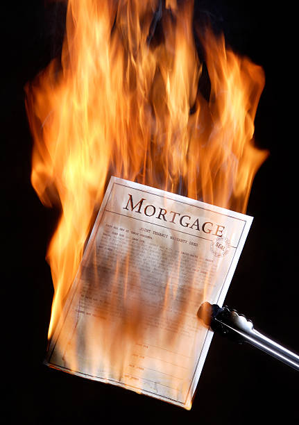 Mortgage burning stock photo