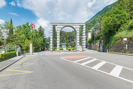 Campione d'Italia - campione ditalia, located on lake Lugano, is an italian town entirely surrounded by the Switzerland (exclave - Canton Ticino); is famous for the presence of a casino. Before the arch we are in Switzerland, after we are in Italy. The name of the town is written on the arch