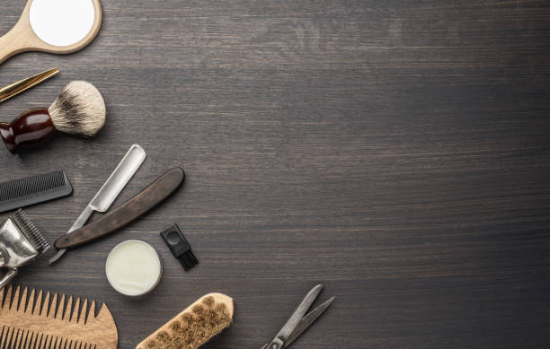 istock Classic grooming and hairdressing tools on wooden background. 1209208464