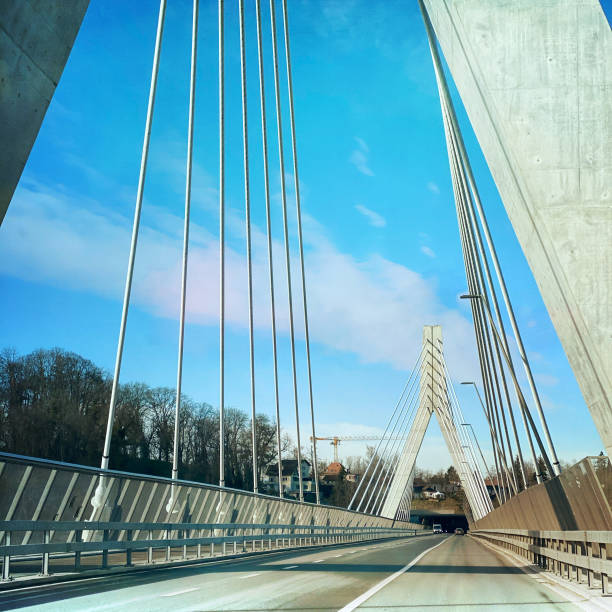 Fribourg, Switzerland - January 7, 2020: Cars are driving over the contemporary cable stayed Poya bridge.This bridge with  a lenght of 851,6 meters above  the Sarine River was inaugurated in October 2014.
