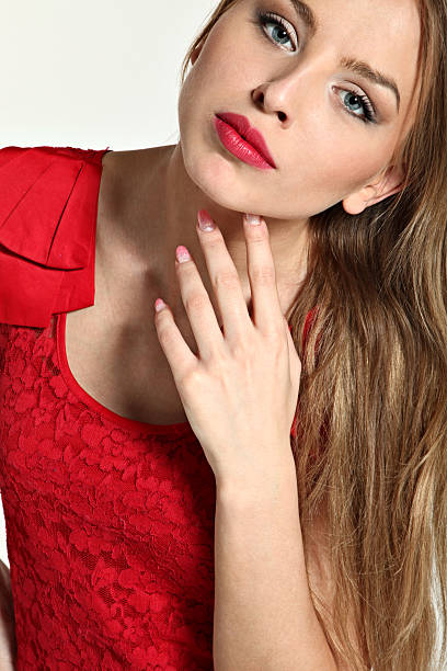 istock beautiful girl dressed in red, studio portrait 120921056