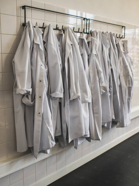 istock white corridor with white lab coats hanging on a hanger 1209211335