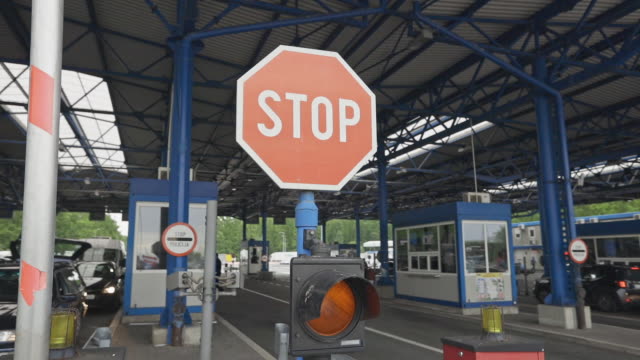 Close-up shot of a barrier of stop sign at the border crossing stock video