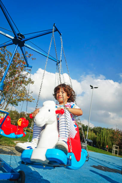 istock Happy little boy laughing at the playground 1209211763