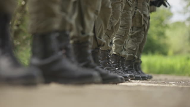 Low-section of military soldiers standing in line 4k stock video