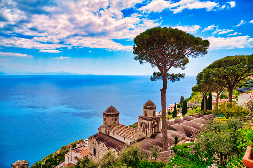 Looking at the famous Villa Rufolo at the small city of Ravello on the Amalfi coast. Many of the small villages along the Amalfi coastline are hundreds of meters above sea level, because of the geographical reasons. The Amalfi coast is a stretch of coastline on the northern coast of the Salerno Gulf on the Tyrrhenian Sea, located in the Province of Salerno of southern Italy. The Amalfi Coast is a popular tourist destination for the region and Italy as a whole, attracting thousands of tourists annually. In 1997, the Amalfi Coast was listed as a UNESCO World Heritage Site.
