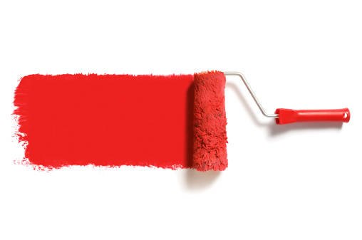 roller brush with red paint