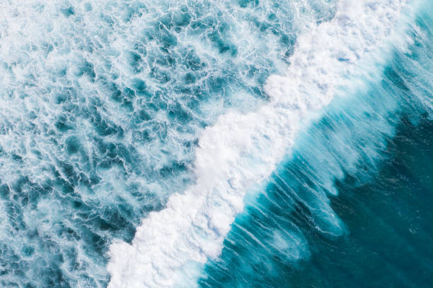 istock Big ocean waves hitting a coral rif. View from above. 1209215065