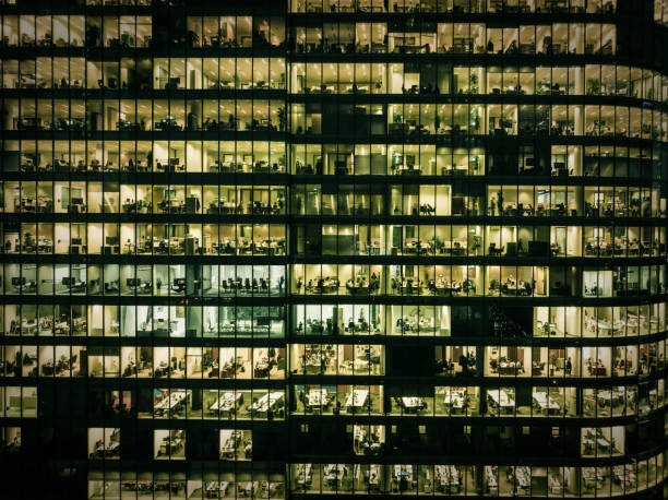 istock Employees in offices, modern glass office building 1209215134