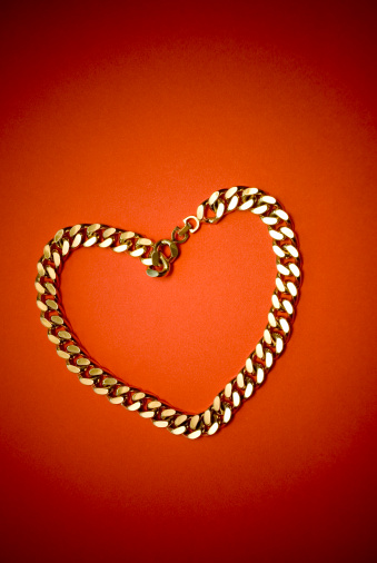 Valentine love heart shaped in a gold chain.