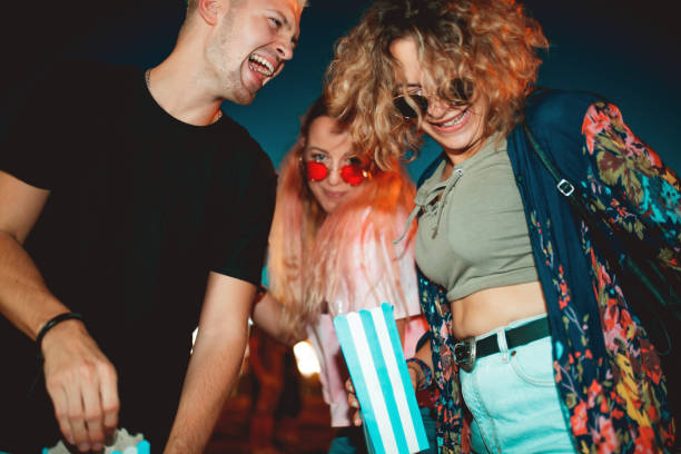 istock Young friends laughing and dancing on outdoor event 1209218219