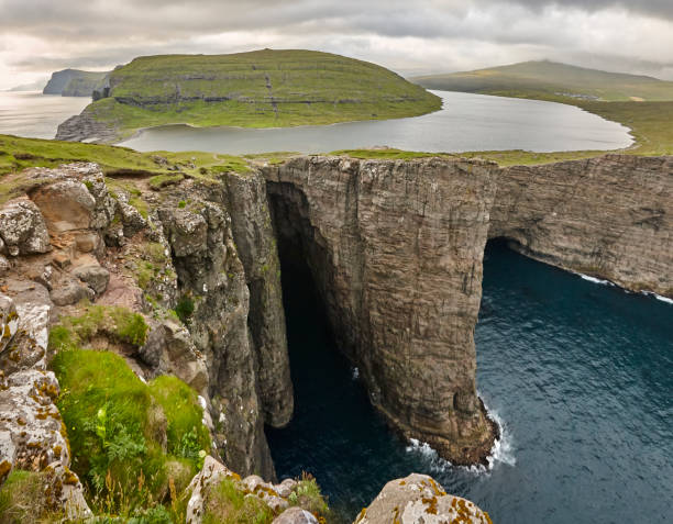 istock Dramatic atlantic rocky coastline cliffs landscape in Vagar. Faroe 1209218252