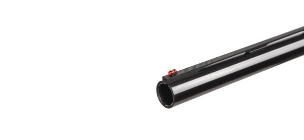 istock Close-up shotgun barrel. Hunting semi-automatic shotgun with wooden butt isolate on white background 1209218328