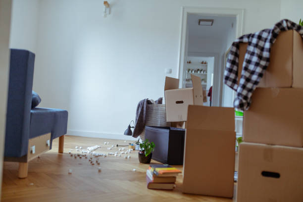 istock Cardboard boxes on the floor in new flat 1209218622